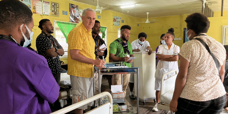 Dr Daniel Priest conducting clinical teaching with local staff in a PNG hospital